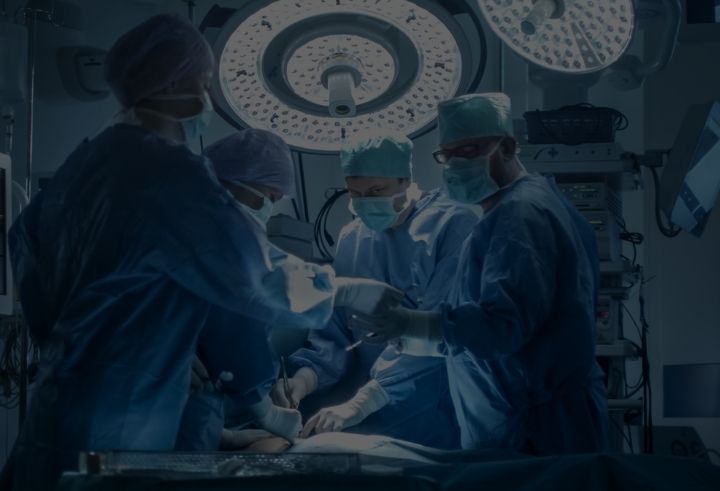 Health professionals undertaking surgery in the hospital operating room